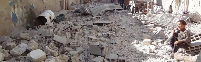 syria-crisis_boy-in-ruins-rubble_1600x500
